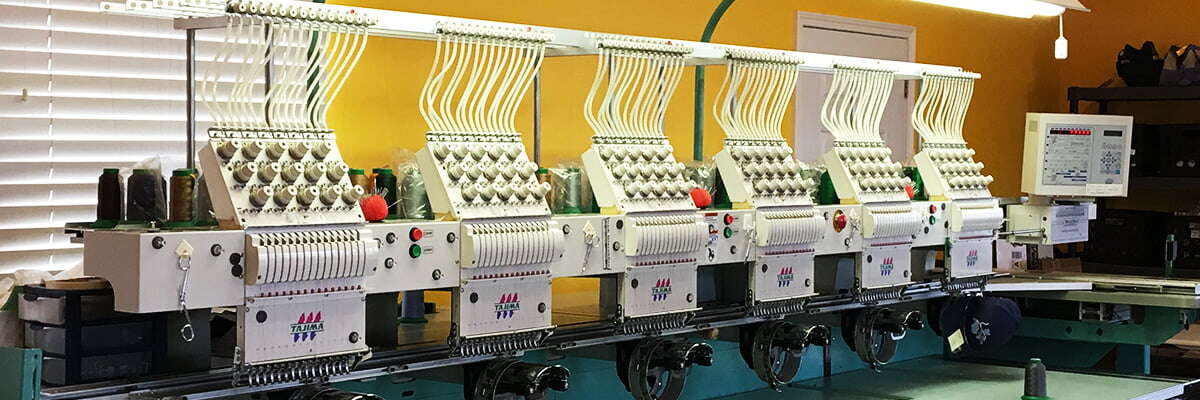 Our row of Tajima embroidery machines in the Jerseyville shop